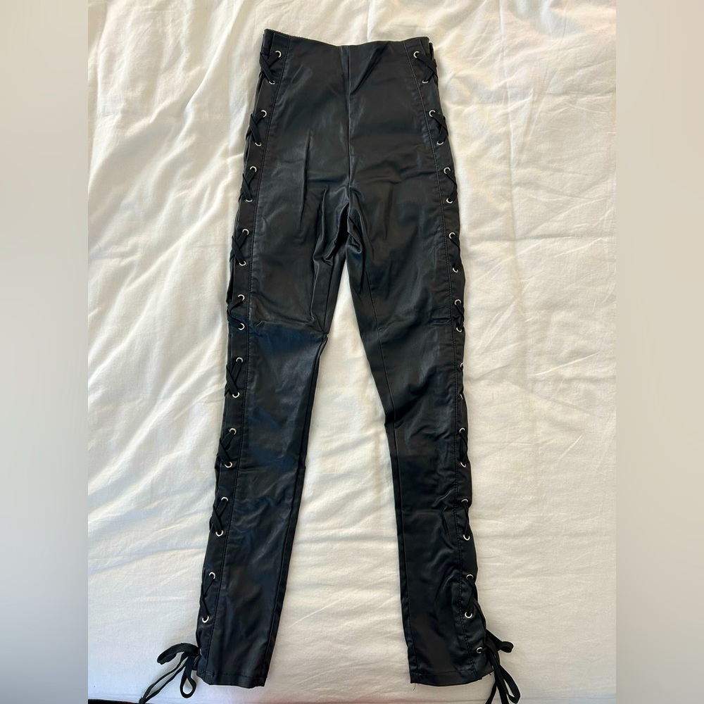 Black leather pants. Size small. Never worn.